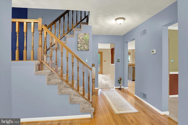 22 Piston Ct, Stewartstown, PA 17363 - stairway with wood finished floors and baseboards