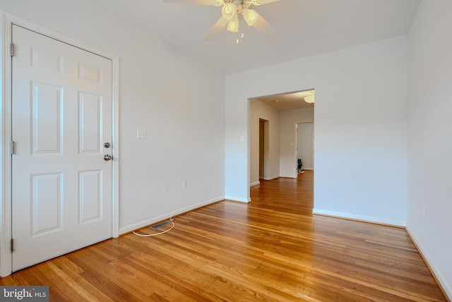 305 Folcroft St, Baltimore, MD 21224 - empty room featuring light wood finished floors and ceiling fan