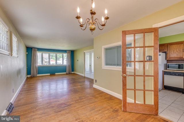 601 King George Rd, Cherry Hill, NJ 08034 - unfurnished dining area featuring a chandelier and light wood-type flooring