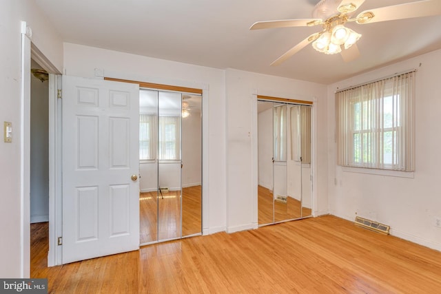 601 King George Rd, Cherry Hill, NJ 08034 - unfurnished bedroom featuring light wood-style floors, two closets, and ceiling fan