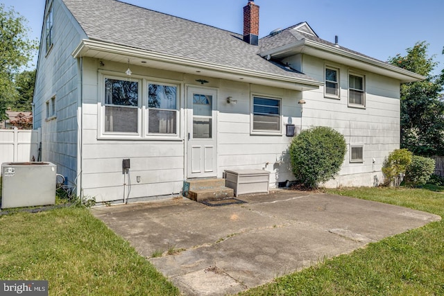 601 King George Rd, Cherry Hill, NJ 08034 - back of house with entry steps, a shingled roof, a patio, and a chimney