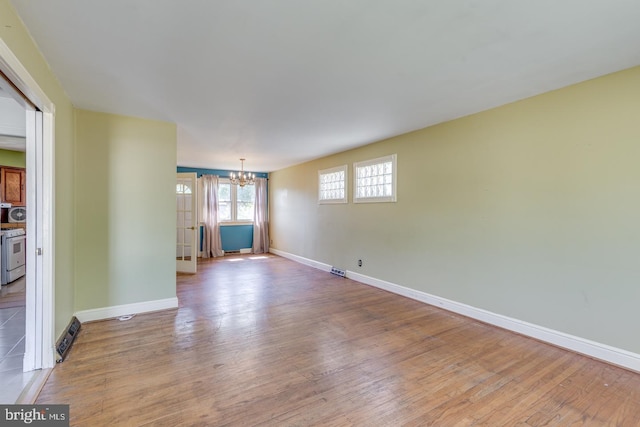 601 King George Rd, Cherry Hill, NJ 08034 - unfurnished room featuring a chandelier and wood finished floors