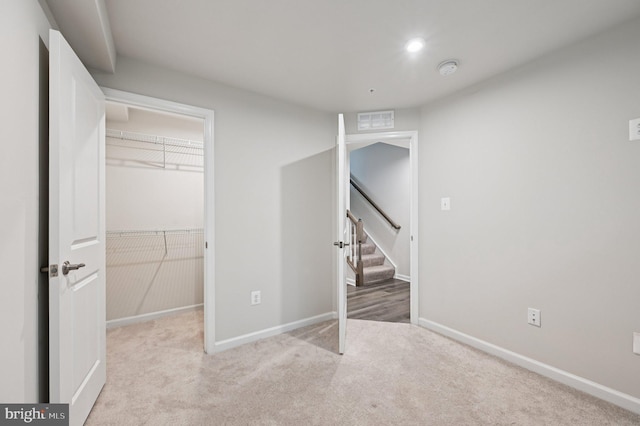 3745 Cedar Mountain Way, Hanover, MD 21076 - unfurnished bedroom featuring a walk in closet, light colored carpet, a closet, and recessed lighting