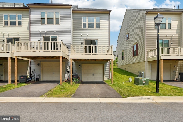 3745 Cedar Mountain Way, Hanover, MD 21076 - back of property featuring a garage, asphalt driveway, and a lawn