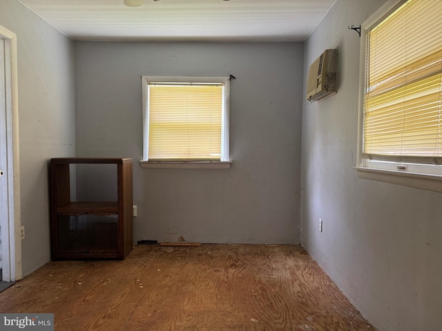 597 Equitation Ln, Felton, DE 19943 - empty room with an AC wall unit and wood finished floors