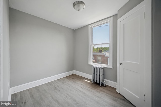510 E Queen Ln, Philadelphia, PA 19144 - empty room with radiator and wood finished floors