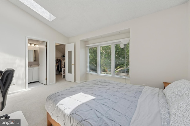 1405 Naomis Ct Unit 1405, North Wales, PA 19454 - bedroom with vaulted ceiling, a skylight, light colored carpet, a spacious closet, and ensuite bathroom