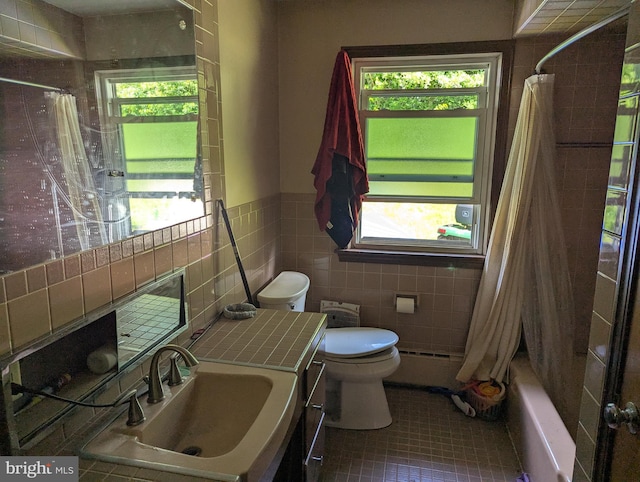 44 Chestnut St, Adamstown, PA 19501 - bathroom with plenty of natural light, shower / bath combo, baseboard heating, vanity, and wainscoting