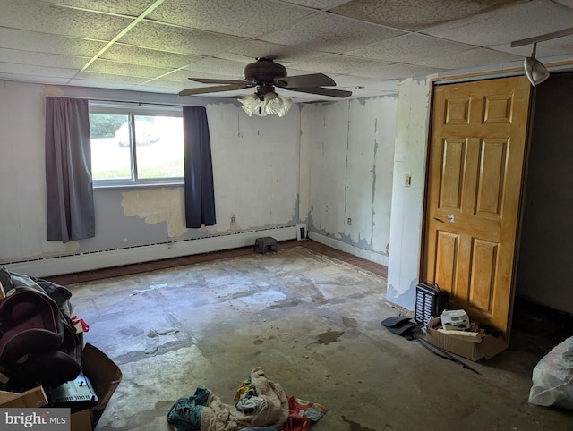 44 Chestnut St, Adamstown, PA 19501 - spare room featuring a baseboard radiator, a drop ceiling, a ceiling fan, and unfinished concrete flooring