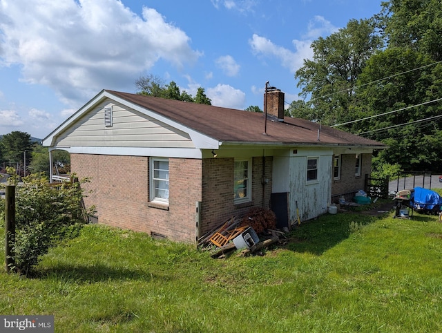 44 Chestnut St, Adamstown, PA 19501 - back of house with a chimney and brick siding