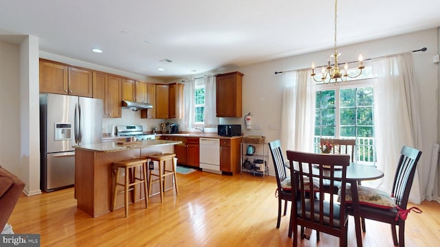 47 Buck Rd, Mays Landing, NJ 08330 - kitchen with stainless steel appliances, a chandelier, a kitchen island, light wood-style flooring, and brown cabinetry