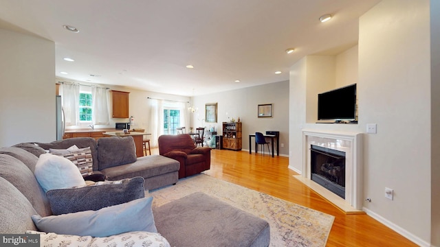 47 Buck Rd, Mays Landing, NJ 08330 - living area featuring light wood-type flooring, a glass covered fireplace, and recessed lighting