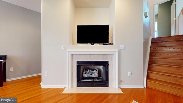 47 Buck Rd, Mays Landing, NJ 08330 - unfurnished living room featuring wood finished floors, a premium fireplace, and stairs