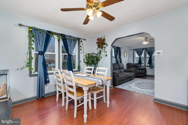5200 Daybreak Ct, Baltimore, MD 21206 - dining room featuring a ceiling fan, wood finished floors, and arched walkways