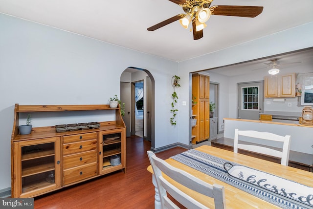 5200 Daybreak Ct, Baltimore, MD 21206 - dining space featuring ceiling fan, arched walkways, and wood finished floors