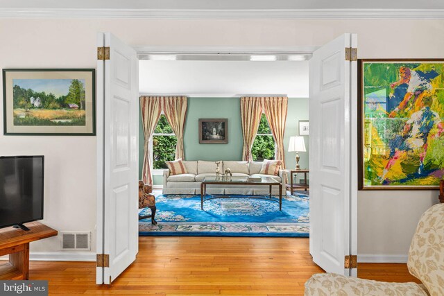 544 N Wayne Ave, Wayne, PA 19087 - living room featuring wood-type flooring and crown molding