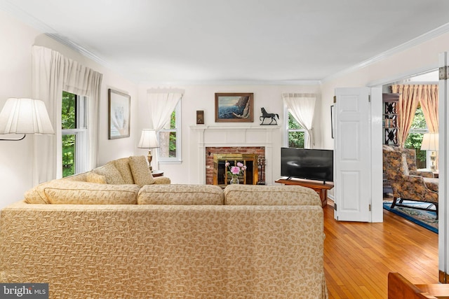 544 N Wayne Ave, Wayne, PA 19087 - living room with healthy amount of natural light, wood finished floors, crown molding, and a brick fireplace