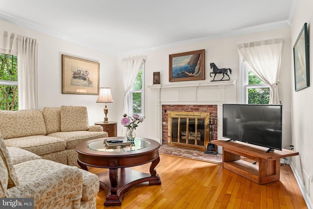 544 N Wayne Ave, Wayne, PA 19087 - living room featuring wood-type flooring, ornamental molding, and a brick fireplace