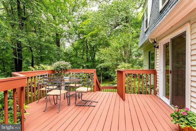 544 N Wayne Ave, Wayne, PA 19087 - wooden deck with outdoor dining space and view of wooded area