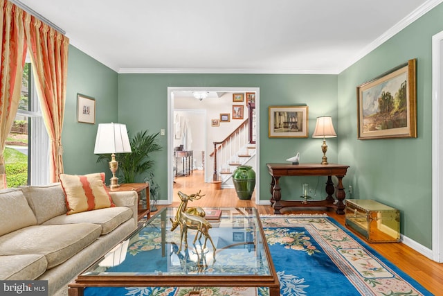 544 N Wayne Ave, Wayne, PA 19087 - living area featuring wood finished floors, stairway, and crown molding