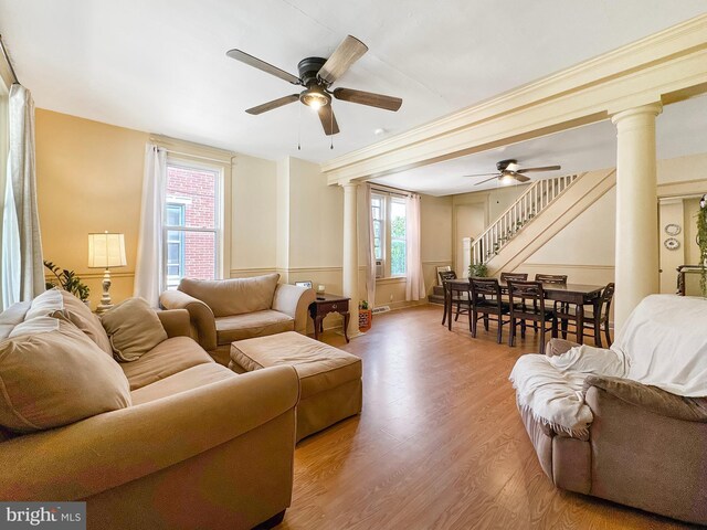 268 N Main St, Red Lion, PA 17356 - living room with ornate columns, a ceiling fan, and stairway
