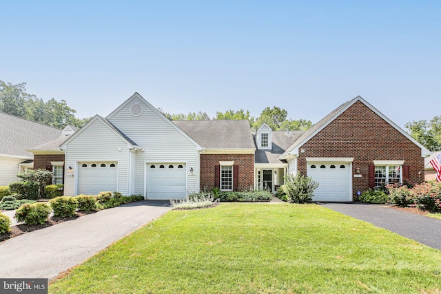 9204 Saint Andrews Ln, Fredericksburg, VA 22408 - view of front facade with asphalt driveway, brick siding, an attached garage, and a front yard