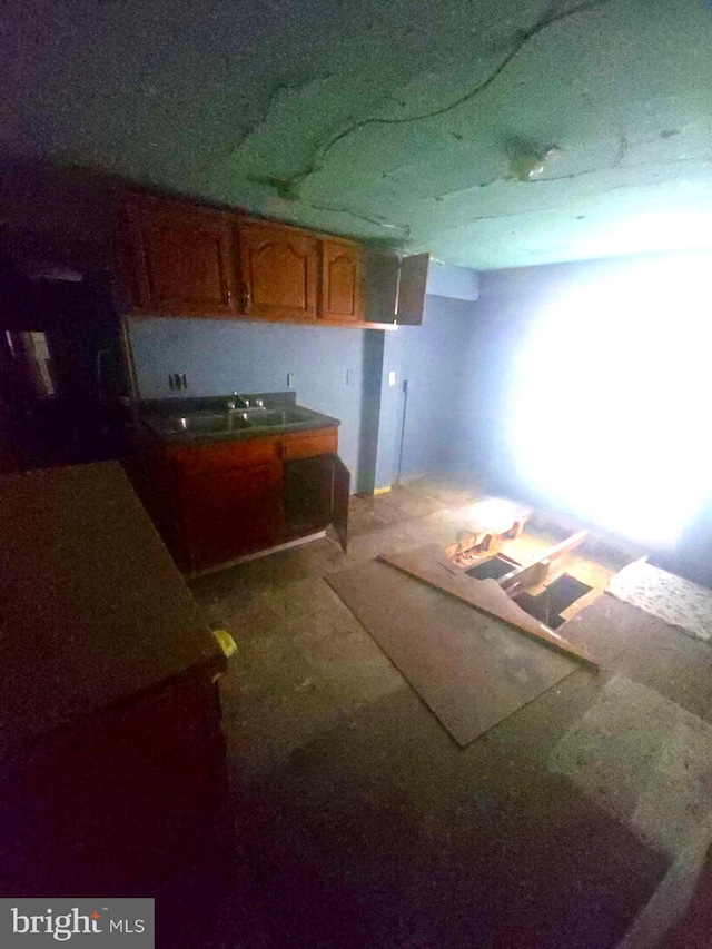 118 S 3rd St, Pottsville, PA 17901 - kitchen with a sink and brown cabinetry