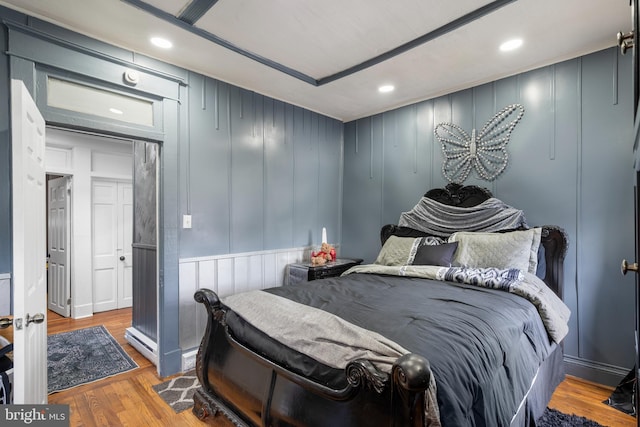 16 N Morley St, Baltimore, MD 21229 - bedroom featuring wood finished floors, recessed lighting, and a decorative wall