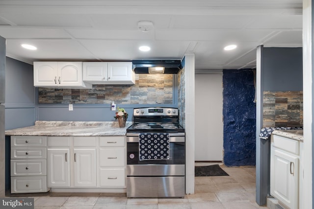 16 N Morley St, Baltimore, MD 21229 - kitchen with stainless steel electric stove, range hood, white cabinetry, decorative backsplash, and light stone countertops