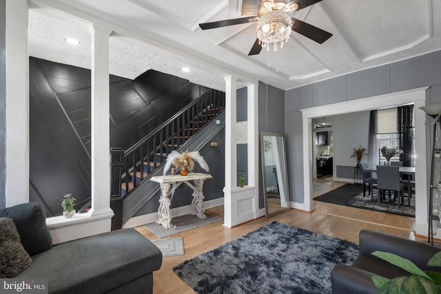 16 N Morley St, Baltimore, MD 21229 - living area featuring stairs, a ceiling fan, and wood finished floors
