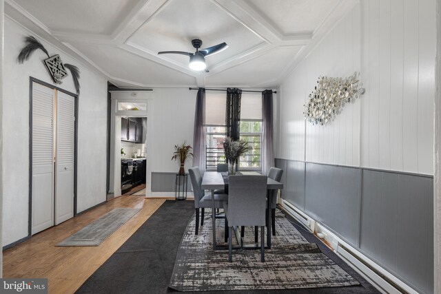 16 N Morley St, Baltimore, MD 21229 - dining space with coffered ceiling, wood finished floors, a ceiling fan, ornamental molding, and a baseboard radiator
