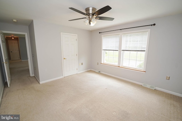 612 S Division St, Fruitland, MD 21826 - unfurnished bedroom with light colored carpet and a ceiling fan