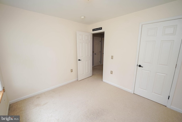 612 S Division St, Fruitland, MD 21826 - unfurnished bedroom with light colored carpet and baseboards