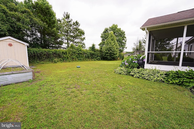 612 S Division St, Fruitland, MD 21826 - view of green lawn with a shed and a sunroom