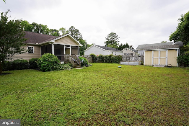 612 S Division St, Fruitland, MD 21826 - view of yard featuring a sunroom and a shed