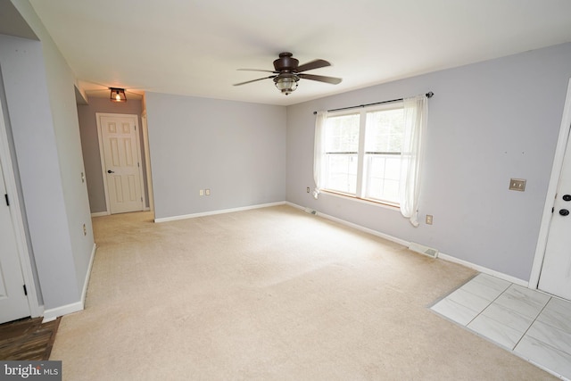 612 S Division St, Fruitland, MD 21826 - spare room featuring a ceiling fan and light carpet