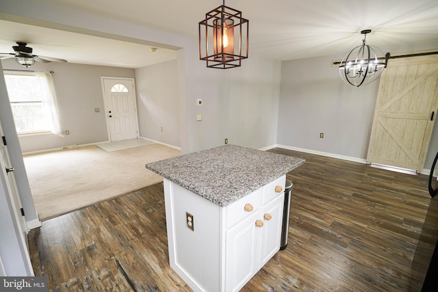 612 S Division St, Fruitland, MD 21826 - kitchen featuring a chandelier, open floor plan, a center island, and pendant lighting