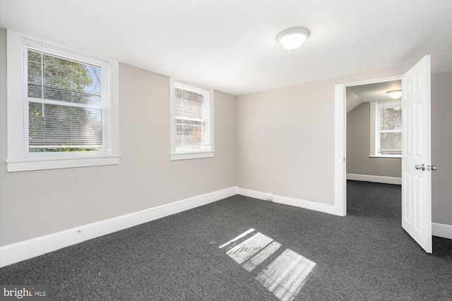 5248 Cordelia Ave, Baltimore, MD 21215 - unfurnished room featuring dark carpet and healthy amount of natural light
