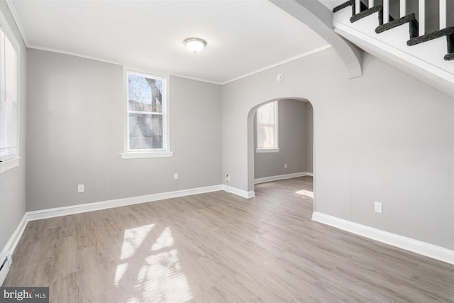 5248 Cordelia Ave, Baltimore, MD 21215 - spare room with arched walkways, wood finished floors, and ornamental molding