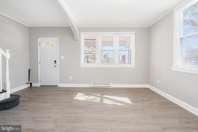5248 Cordelia Ave, Baltimore, MD 21215 - entryway with a baseboard radiator, ornamental molding, wood finished floors, and stairway