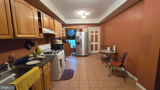 1260 E State St, Trenton, NJ 08609 - kitchen with stainless steel fridge with ice dispenser, white range with gas stovetop, under cabinet range hood, light tile patterned flooring, and open shelves