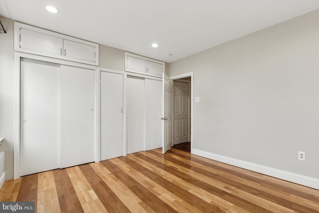 252 N 3rd St, North Wales, PA 19454 - unfurnished bedroom featuring two closets, light wood-style flooring, and recessed lighting
