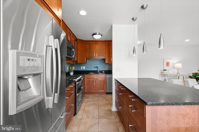 3515 Washington Blvd Unit 316, Arlington, VA 22201 - kitchen featuring appliances with stainless steel finishes, backsplash, light tile patterned floors, a center island, and decorative light fixtures
