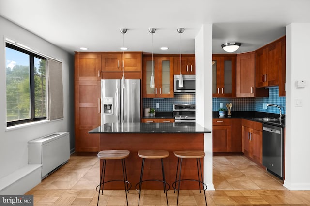 3515 Washington Blvd Unit 316, Arlington, VA 22201 - kitchen with stainless steel appliances, glass insert cabinets, tasteful backsplash, a kitchen island, and recessed lighting