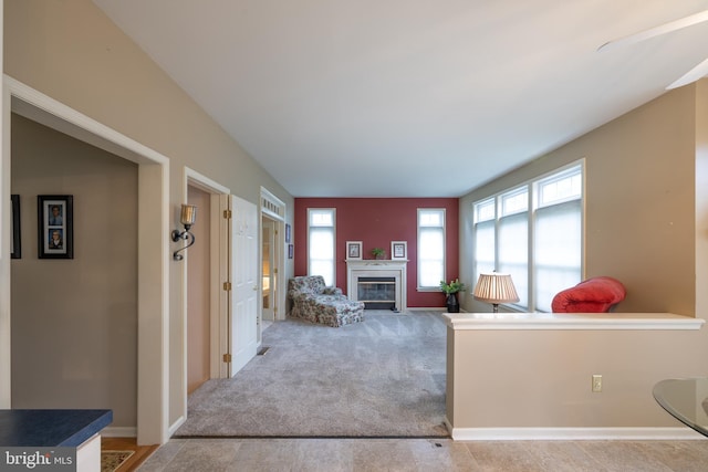 5900 Wayside Dr, Macungie, PA 18062 - living area with a glass covered fireplace and light carpet
