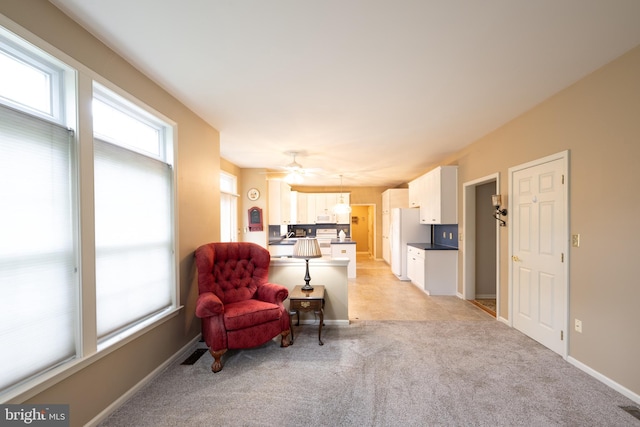 5900 Wayside Dr, Macungie, PA 18062 - living room with healthy amount of natural light, light colored carpet, and ceiling fan