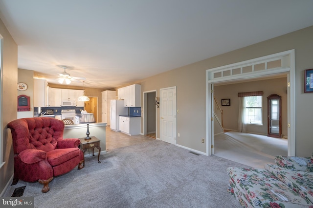5900 Wayside Dr, Macungie, PA 18062 - living room with light colored carpet and a ceiling fan