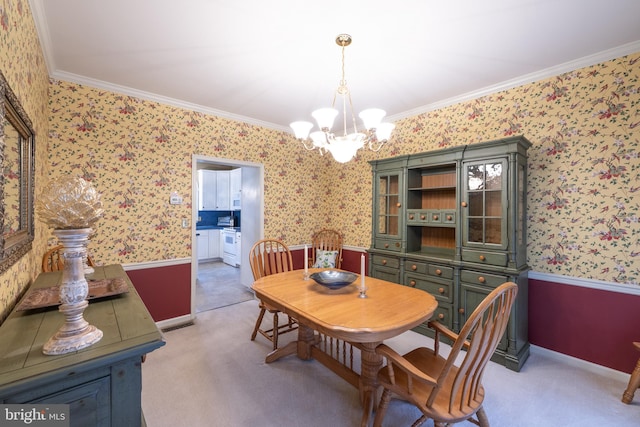 5900 Wayside Dr, Macungie, PA 18062 - dining space with wallpapered walls, a chandelier, crown molding, and light colored carpet