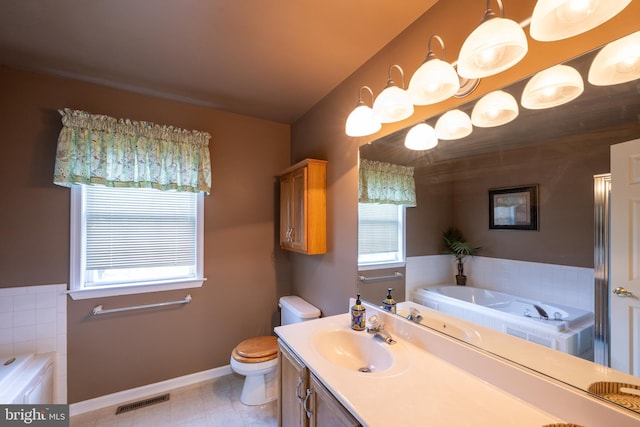 5900 Wayside Dr, Macungie, PA 18062 - bathroom with healthy amount of natural light, a bath, vanity, and tile patterned floors