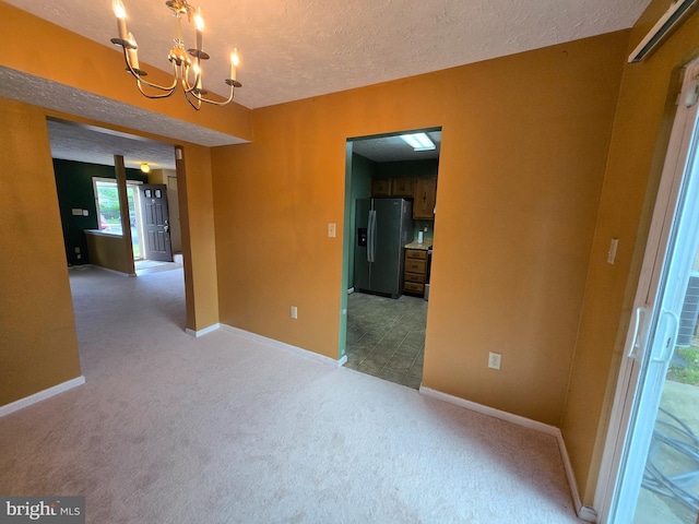 14 Riverside Run Dr, Indian Head, MD 20640 - carpeted empty room featuring a chandelier and a textured ceiling